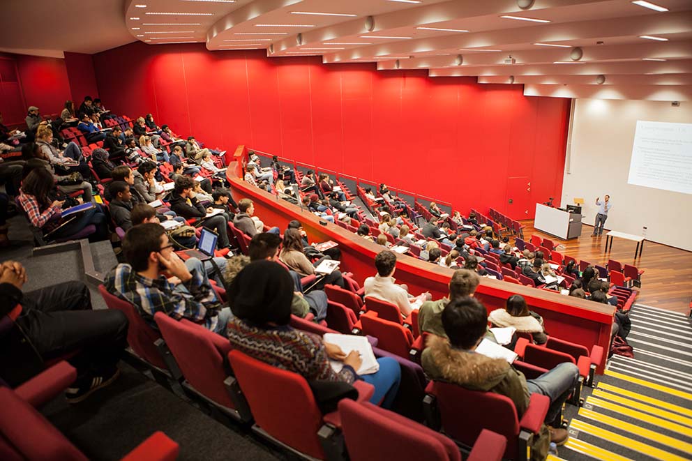 View from the back of a lecture hall, looking toward the front of the room