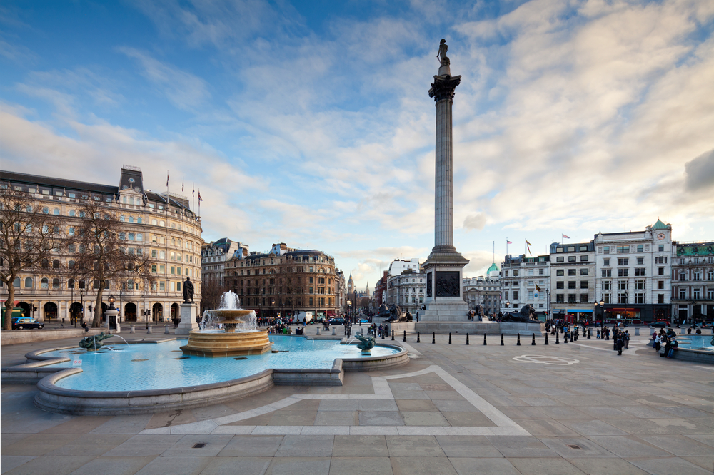 Sunny day overlooking Trafalgar Square fountains