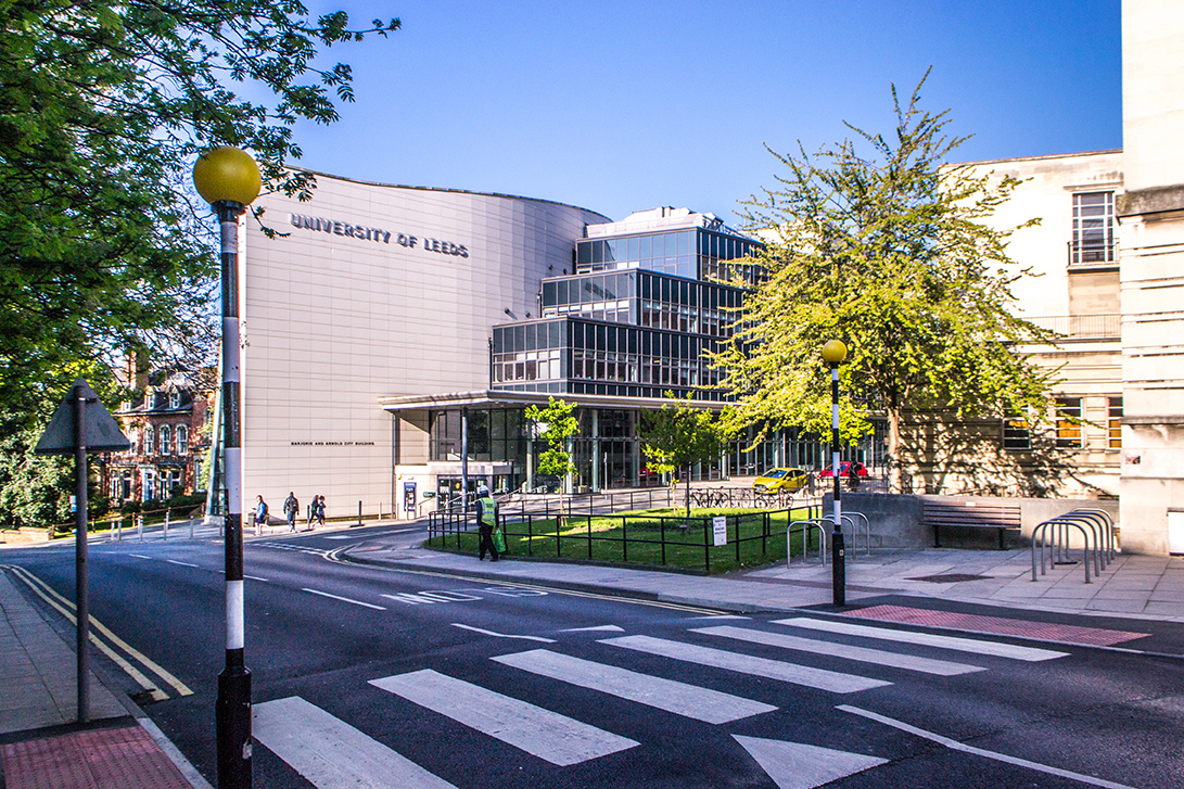 Looking across a cross walk to a Leeds campus building