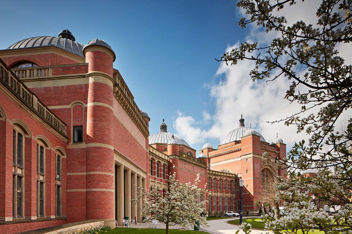 Birmingham red brick campus buildings with trees