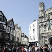 Street view looking up to Canterbury buildings along the street, filled with people
