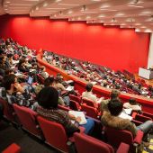 View from the back of a lecture hall, looking toward the front of the room