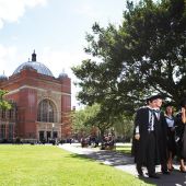 Old university building with graduating students in foreground